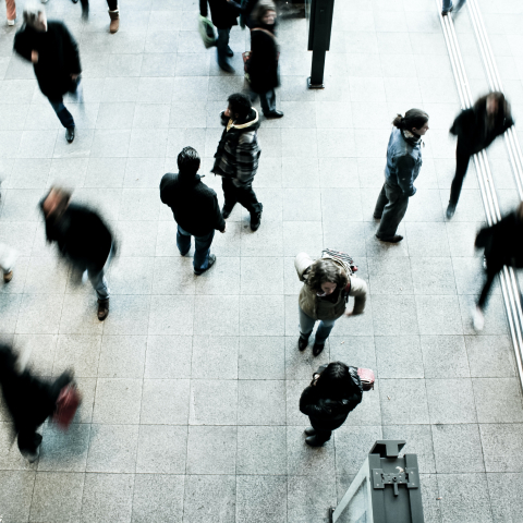 people walking in a building.