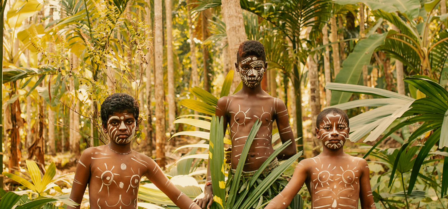 youn siddi dancers pose for a portrait in karnataka, india