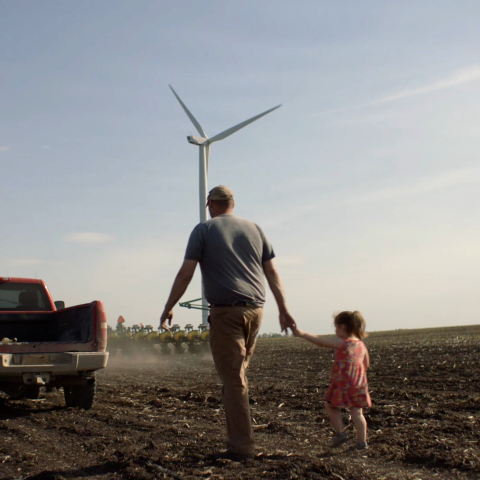 Father and daugther walking in their farm.