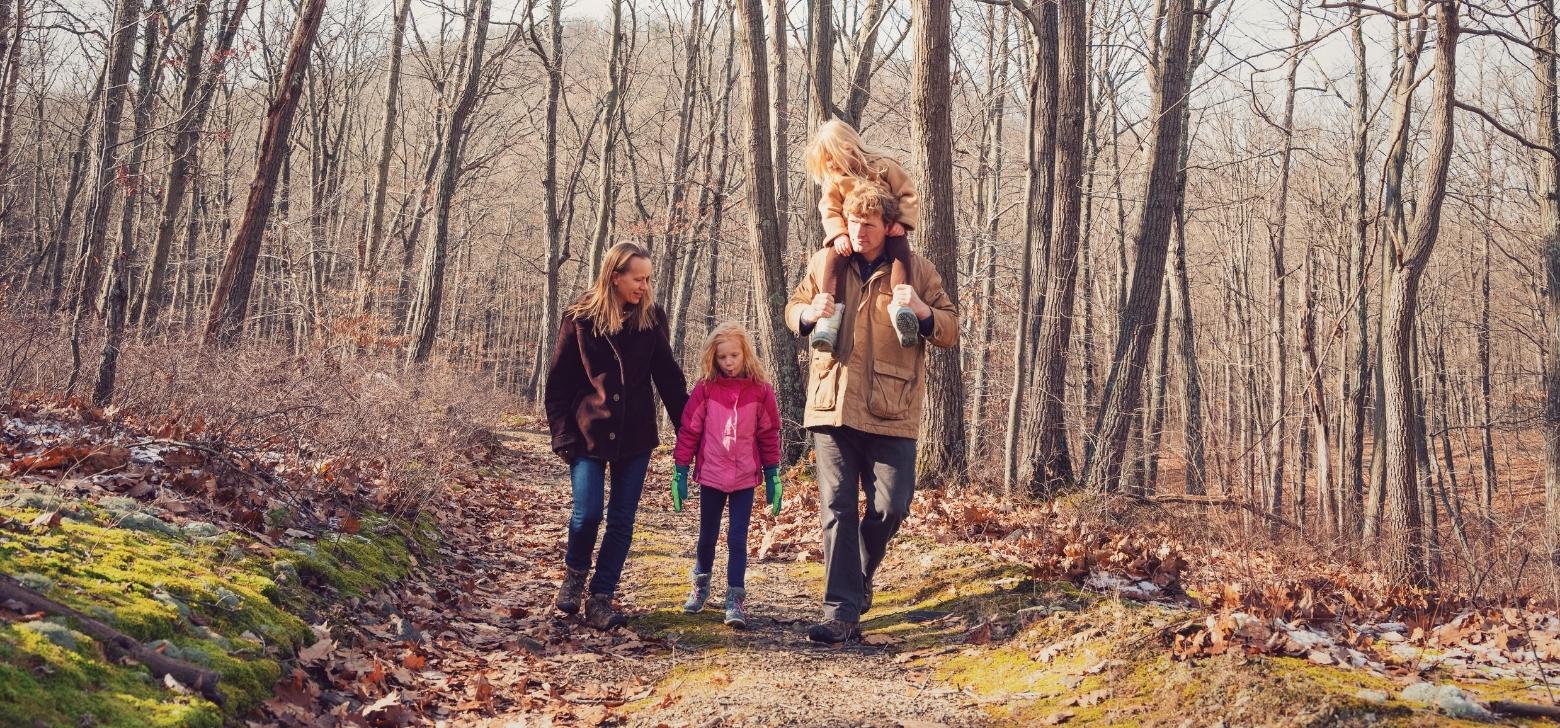 Josh Parrish, Director of the American Forest Carbon Initiative, and his family walk through Chestnut Farm in Pennsylvania