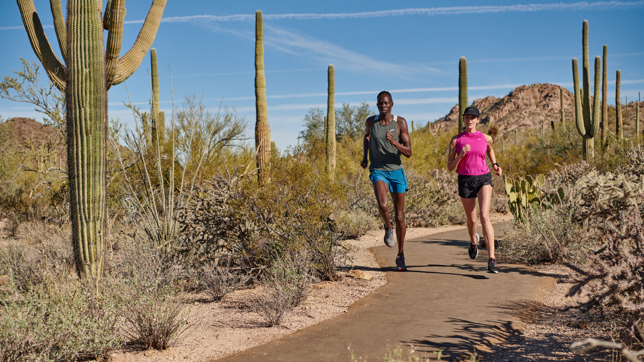 Runners wearing the carbon neutral Ghost 14 shoe on a trail in Tucson, Arizona. Image courtesy of Brooks Running.