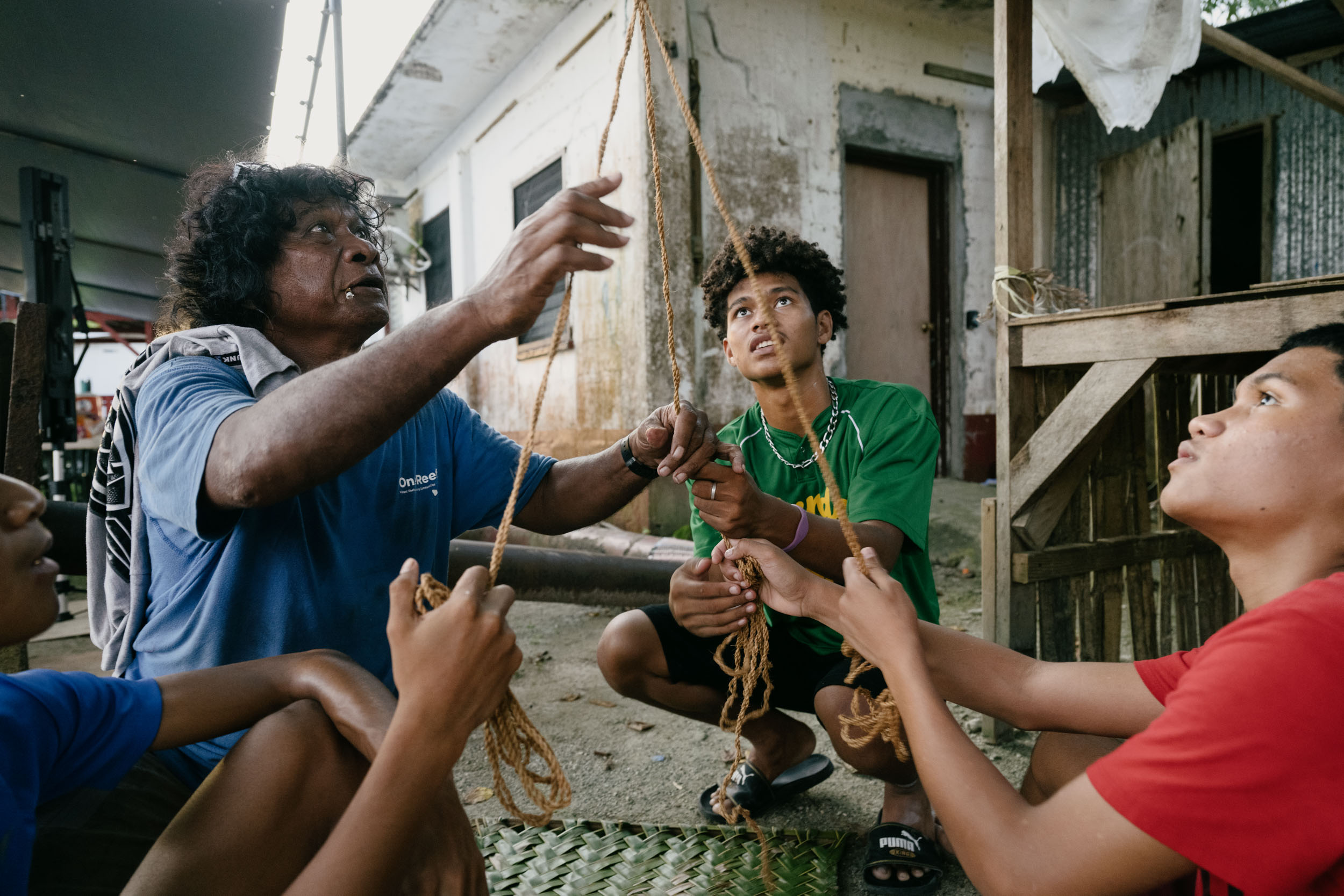 Elder and master navigator Akilino Alvis mentors teenage boys in Echang.